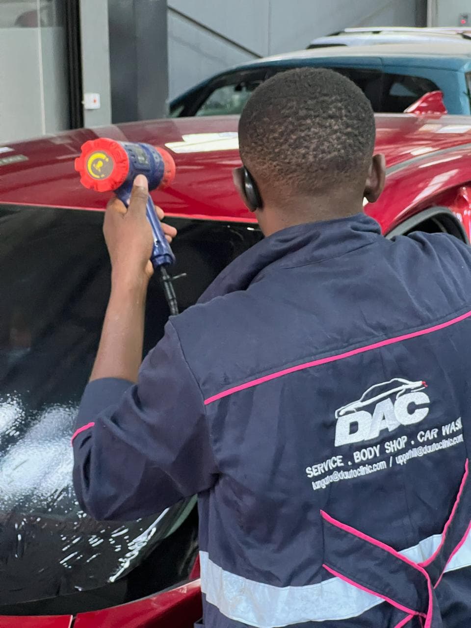 New driver checking tyres on their car before setting off