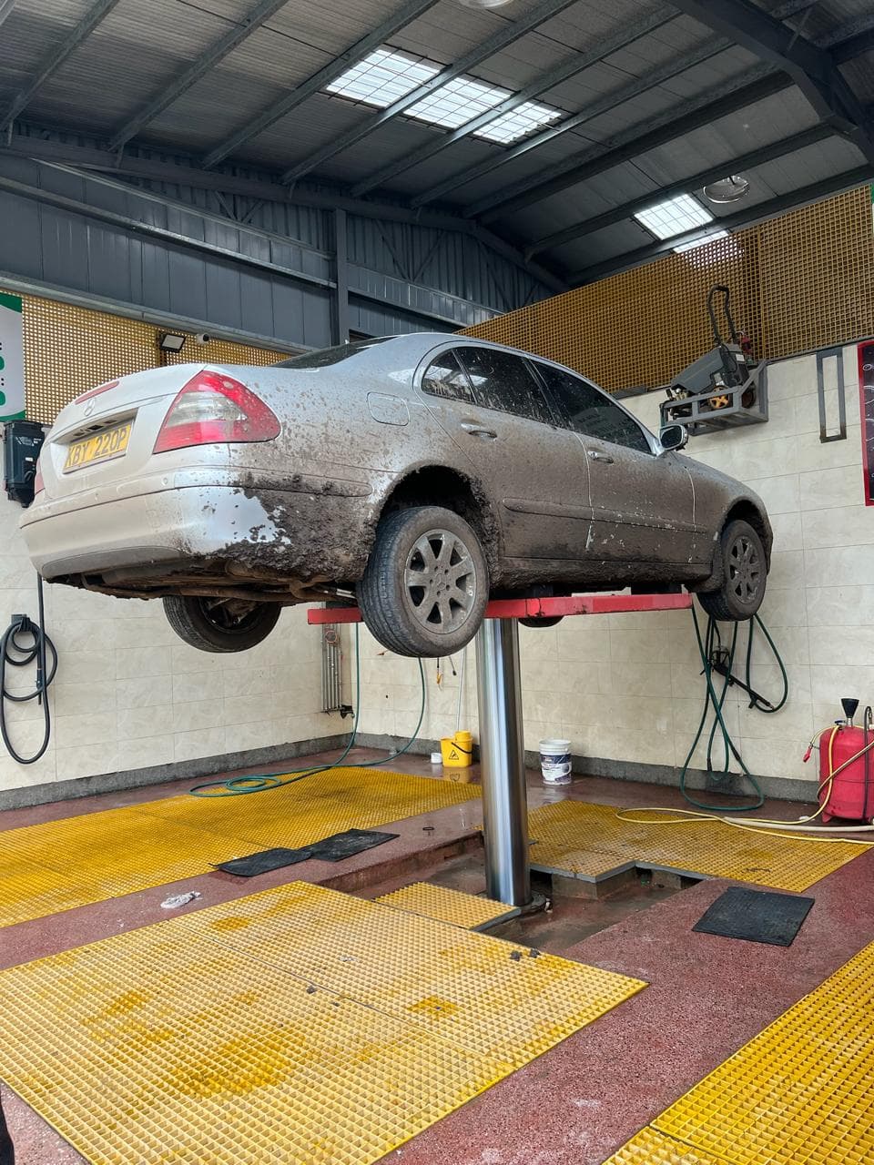 Checking engine oil level with a dipstick in a car engine bay